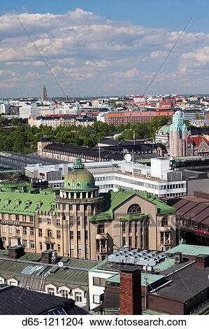 Picture - Finland, Helsinki, elevated city view to the Rautatientori, Helsinki Train Station, from the Hotel Torni. Fotosearch