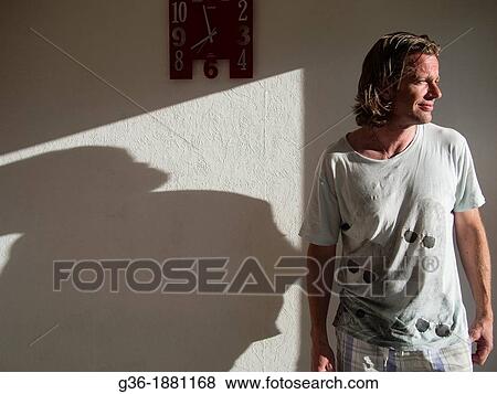 Finnish man in home in summer light in Nastoland, Finland View Large Photo Image Stock Photo - Finnish man in home in summer light in Nastoland, Finland. Fotosearch