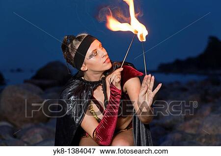 Fire Dancer Woman Fire Dancer in Costume Juggling Torches View Large Photo Image Stock Photo - Fire Dancer Woman Fire Dancer in Costume Juggling Torches. Fotosearch