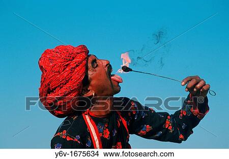 Fire eater at Pushkar, Rajasthan, India. View Large Photo Image Picture - Fire eater at Pushkar, Rajasthan, India.. Fotosearch