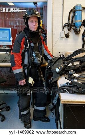 Firefighter in fireproof turnout gear on his regular job in the barracks. View Large Photo Image Stock Image - Firefighter in fireproof turnout gear on his regular job in the barracks.. Fotosearch
