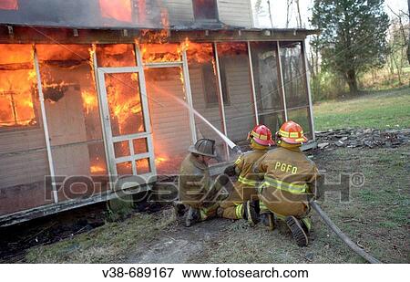 Firefighters fight a house fire in Bowie, Maryland, USA View Large Photo Image Stock Photo - Firefighters fight a house fire in Bowie, Maryland, USA. Fotosearch