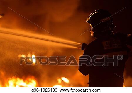 Firemen, at work View Large Photo Image Stock Image - Firemen, at work. Fotosearch
