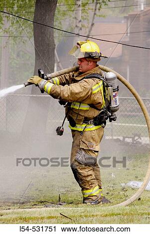 Firemen battle a residential home fire View Large Photo Image Stock Image - Firemen battle a residential home fire. Fotosearch