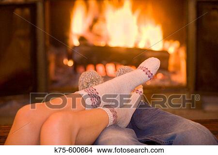 Picture - fireside togetherness. Fotosearch
