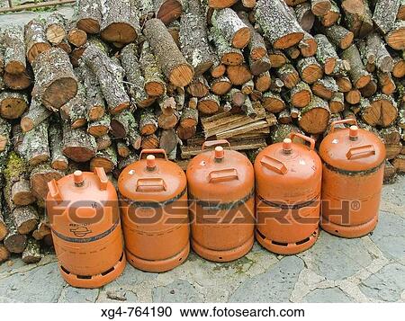 Firewood and butane gas cylinder, Beget. Alta Garrotxa, Girona province, Catalonia, Spain View Large Photo Image Stock Image - Firewood and butane gas cylinder, Beget. Alta Garrotxa, Girona province, Catalonia, Spain. Fotosearch