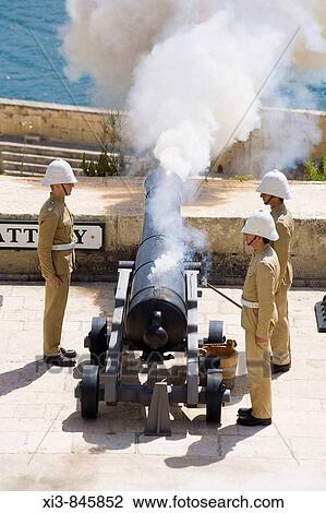 Firing of the noon day gun, at the Saluting Battery, Upper Barracca Gardens, Valletta, Malta View Large Photo Image Stock Image - Firing of the noon day gun, at the Saluting Battery, Upper Barracca Gardens, Valletta, Malta. Fotosearch