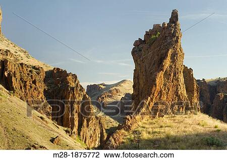 First light on the volcanic spires of Succor Creek State Park in the Owyhee Uplands of SE Oregon View Large Photo Image Stock Image - First light on the volcanic spires of Succor Creek State Park in the Owyhee Uplands of SE Oregon. Fotosearch