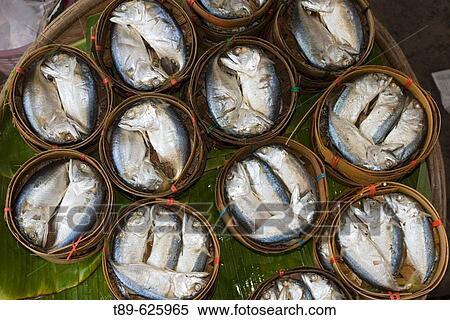Fish Baskets at Floating Market southwest of Bangkok. Amphawa Floating Market. Vegetable vendors meet on canal in the afternoon every friday saturday and sunday to sell their products View Large Photo Image Stock Photography - Fish Baskets at Floating Market southwest of Bangkok. Amphawa Floating Market. Vegetable vendors meet on canal in the afternoon every friday saturday and sunday to sell their products. Fotosearch