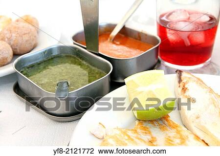 Fish fillet with papas arrugas, typical boiled potatoes with sauces, Canary islands Spain. View Large Photo Image Stock Image - Fish fillet with papas arrugas, typical boiled potatoes with sauces, Canary islands Spain.. Fotosearch