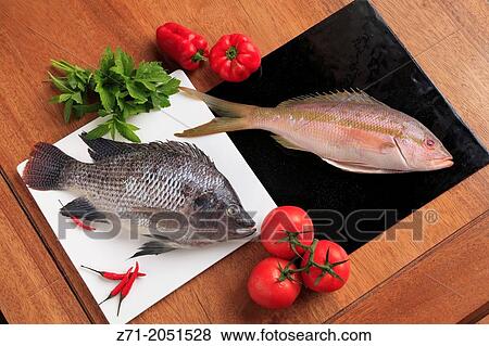 Fish, tilapia, yellowtail snapper,. View Large Photo Image Stock Photo - Fish, tilapia, yellowtail snapper,.. Fotosearch