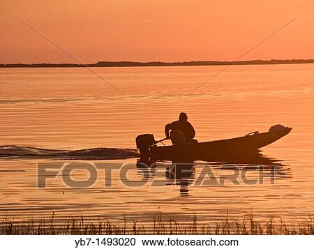Fisher Man going home at Sunset Florida, USA View Large Photo Image Stock Image - Fisher Man going home at Sunset Florida, USA. Fotosearch