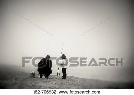 Fisherman and girl on the beach one day of thick fog. View Large Photo Image Stock Image - Fisherman and girl on the beach one day of thick fog.. Fotosearch