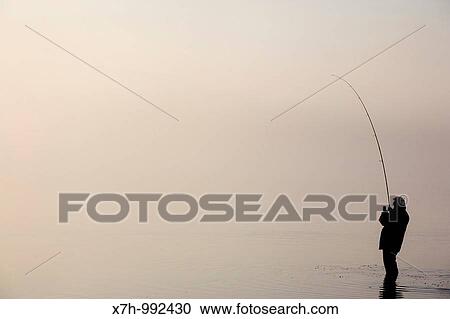 Fisherman at Bassenthwaite Lake, Cumbria, England View Large Photo Image Stock Image - Fisherman at Bassenthwaite Lake, Cumbria, England. Fotosearch