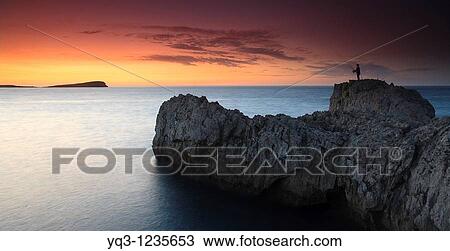 Fisherman at sunset on the Punta del Najo, Islares, Castro Urdiales, Cantabria, Spain. View Large Photo Image Stock Image - Fisherman at sunset on the Punta del Najo, Islares, Castro Urdiales, Cantabria, Spain.. Fotosearch