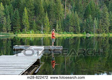 Fisherman in red shirt trying his luck from a dock on Black Pine Lake North Cascades Washington USA View Large Photo Image Stock Image - Fisherman in red shirt trying his luck from a dock on Black Pine Lake North Cascades Washington USA. Fotosearch