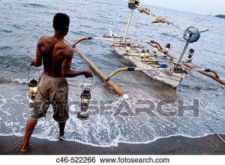 Fisherman, Lovina beach. Bali Island, Indonesia View Large Photo Image Stock Photograph - Fisherman, Lovina beach. Bali Island, Indonesia. Fotosearch