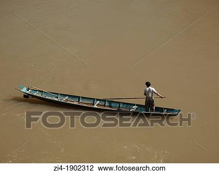 Fisherman on his boat paddling on the Mekong River in Luang Prabang Laos View Large Photo Image Stock Image - Fisherman on his boat paddling on the Mekong River in Luang Prabang Laos. Fotosearch