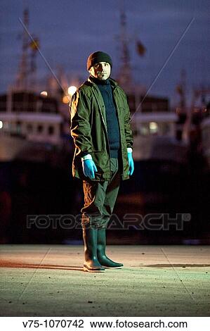 Fisherman posing on harbour at dawn View Large Photo Image Stock Image - Fisherman posing on harbour at dawn. Fotosearch