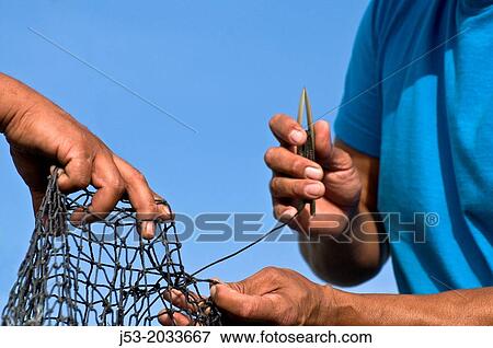 Fisherman repairing trawl net, Bellingham, Washington USA. View Large Photo Image Stock Photo - Fisherman repairing trawl net, Bellingham, Washington USA.. Fotosearch
