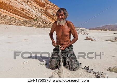 Fisherman, Shouab beach, Qalansiyah, Socotra island, listed as World Heritage by UNESCO, Aden Governorate, Yemen, Arabia, West Asia. View Large Photo Image Stock Photograph - Fisherman, Shouab beach, Qalansiyah, Socotra island, listed as World Heritage by UNESCO, Aden Governorate, Yemen, Arabia, West Asia.. Fotosearch