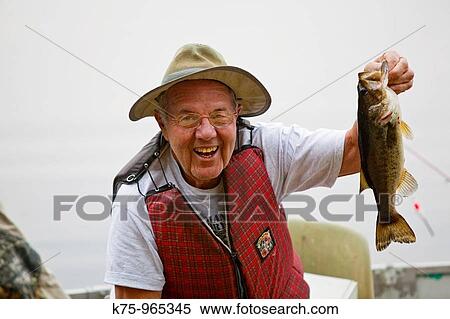 fisherman with bass View Large Photo Image Stock Photography - fisherman with bass. Fotosearch