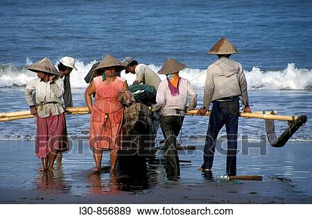 Stock Photo - Fishermen at Pangandaran beach, Java, Indonesia. Fotosearch
