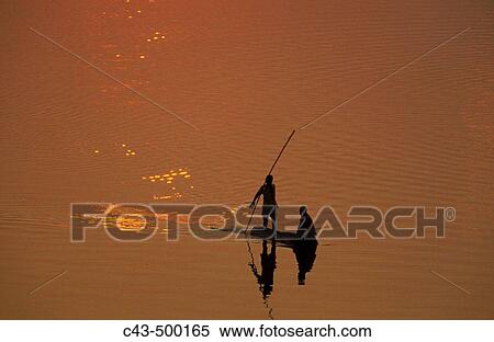 Fishermen at sunset on the Luangwa river. South Luangwa National Park, Zambia. View Large Photo Image Stock Photography - Fishermen at sunset on the Luangwa river. South Luangwa National Park, Zambia.. Fotosearch