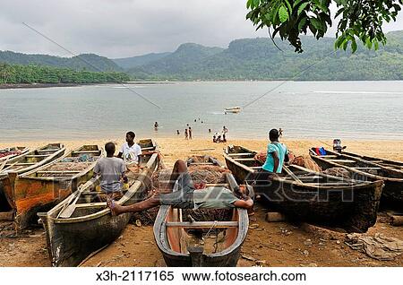 fishermen having a rest on the beach of Porto Alegre village in the south of Sao Tome Island, Republic of Sao Tome and Principe, Africa. View Large Photo Image Stock Photography - fishermen having a rest on the beach of Porto Alegre village in the south of Sao Tome Island, Republic of Sao Tome and Principe, Africa.. Fotosearch