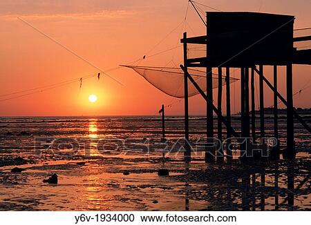 Stock Image - Fishermen huts on stilts. France.. Fotosearch