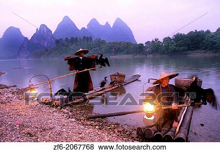 Stock Photo - Fishermen Li River with birds Yangshuo China, Guilin Yangshou Li River Fishermen Limestone Mountains.. Fotosearch