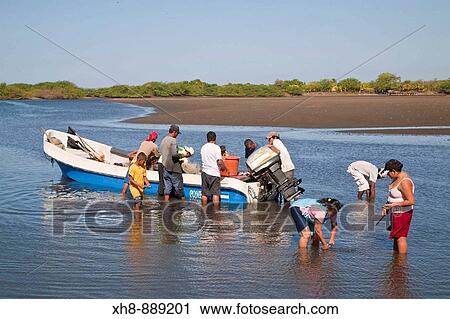 Stock Image - Fishermen, Poneloya beach, Leon, Nicaragua. Fotosearch