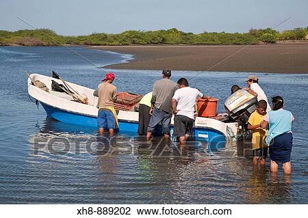 Stock Image - Fishermen, Poneloya beach, Leon, Nicaragua. Fotosearch