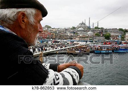 Fishermen standing on the Galata bridge with a view over the Bazaar Quarter, Istanbul, Turkey View Large Photo Image Stock Image - Fishermen standing on the Galata bridge with a view over the Bazaar Quarter, Istanbul, Turkey. Fotosearch