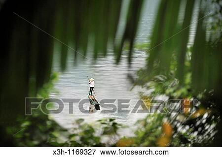 fisherwoman with a dugout canoe on Ba Be Lake, Bac Kan province, Northern Vietnam, southeast asia View Large Photo Image Stock Photo - fisherwoman with a dugout canoe on Ba Be Lake, Bac Kan province, Northern Vietnam, southeast asia. Fotosearch
