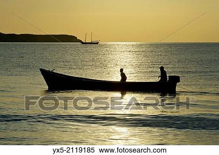 Fishing boat in the open sea at sunrise. View Large Photo Image Stock Photography - Fishing boat in the open sea at sunrise.. Fotosearch