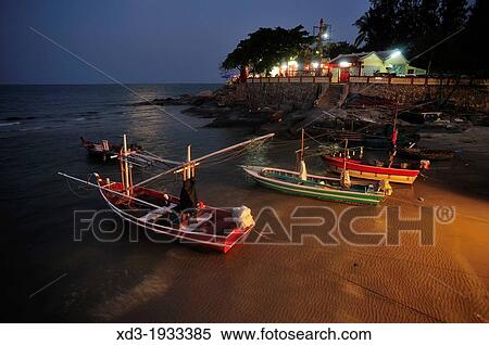 fishing boats anchored in shallow water at high tide, Hua Hin, Prachuap Khiri Khan Province, Thailand View Large Photo Image Stock Photography - fishing boats anchored in shallow water at high tide, Hua Hin, Prachuap Khiri Khan Province, Thailand. Fotosearch