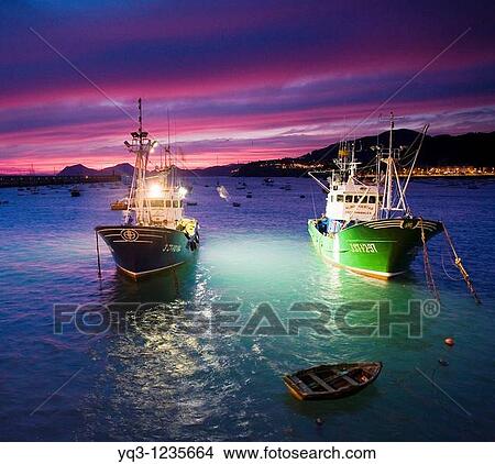 Picture - Fishing boats at dawn. Port of Castro Urdiales, Cantabria, Spain.. Fotosearch