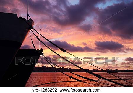 Stock Image - Fishing boats at sunset Puerto de La Luz, Las Palmas, Gran Canaria, Canary Islands, Spain. Fotosearch