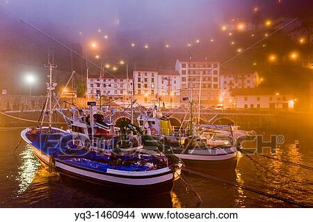 Fishing boats in the mist at sunrise, port of Elantxobe, Urdaibai, Vizcaya, Basque Country, Spain View Large Photo Image Picture - Fishing boats in the mist at sunrise, port of Elantxobe, Urdaibai, Vizcaya, Basque Country, Spain. Fotosearch