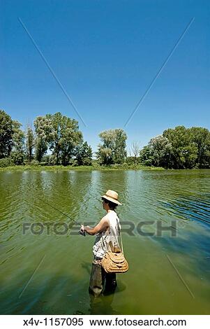 Stock Photography - Fishing in Arno River, Ponte Buriano, Arezzo, Tuscany, Italy, Europe, M R. Fotosearch