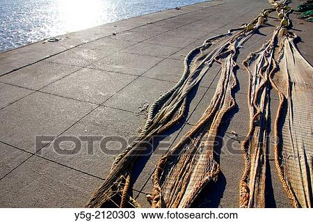 fishing nets in fiumicino port near rome italy View Large Photo Image Stock Image - fishing nets in fiumicino port near rome italy. Fotosearch