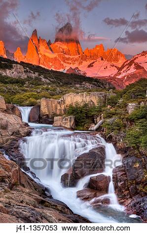 FitzRoy waterfall at dawn under famous rock peak Cerro FitzRoy El Chalten, Parque Nacional Los Glaciares, Patagonia, Argentina. View Large Photo Image Stock Image - FitzRoy waterfall at dawn under famous rock peak Cerro FitzRoy El Chalten, Parque Nacional Los Glaciares, Patagonia, Argentina.. Fotosearch