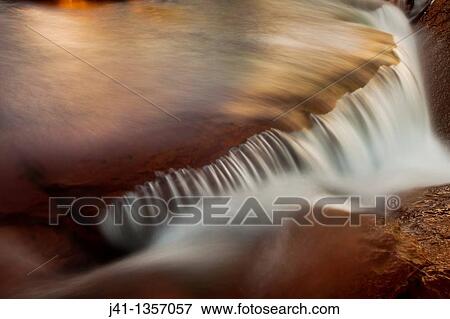 FitzRoy waterfall rapid catches first rays of dawn light under famous rock peak Cerro FitzRoy El Chalten, Parque Nacional Los Glaciares, Patagonia, Argentina. View Large Photo Image Stock Photo - FitzRoy waterfall rapid catches first rays of dawn light under famous rock peak Cerro FitzRoy El Chalten, Parque Nacional Los Glaciares, Patagonia, Argentina.. Fotosearch