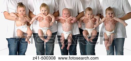 Five babies hanging on their mother arms View Large Photo Image Stock Photo - Five babies hanging on their mother arms. Fotosearch