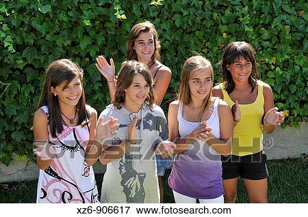 five friends clapping in the park View Large Photo Image Stock Photo - five friends clapping in the park. Fotosearch