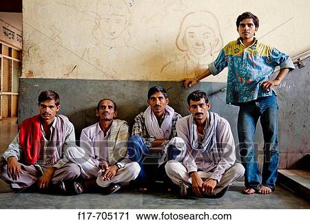 Five indian men patiently waiting for a train in the train station. View Large Photo Image Stock Image - Five indian men patiently waiting for a train in the train station.. Fotosearch