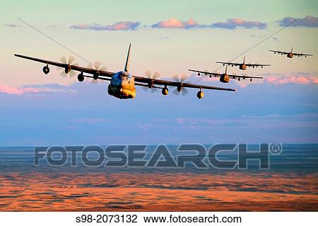 Stock Image - Five MC-130J Commando IIs conduct low-level formation training over Clovis, N. M., Nov. 5, 2013.. Fotosearch