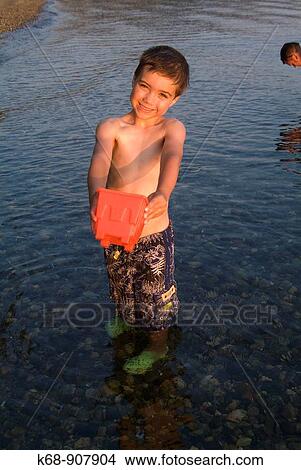 Picture - five year old boy in water at Porpoise Bay, BC, Canada. Fotosearch