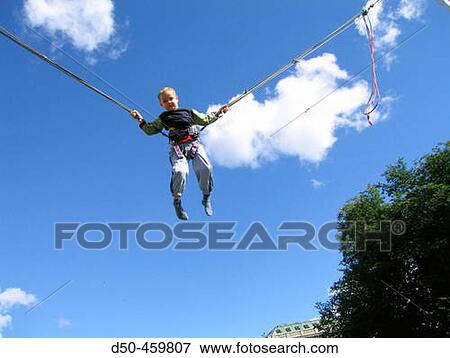 Five year old bunjee jumping, Stockholm, Sweden View Large Photo Image Stock Photo - Five year old bunjee jumping, Stockholm, Sweden. Fotosearch